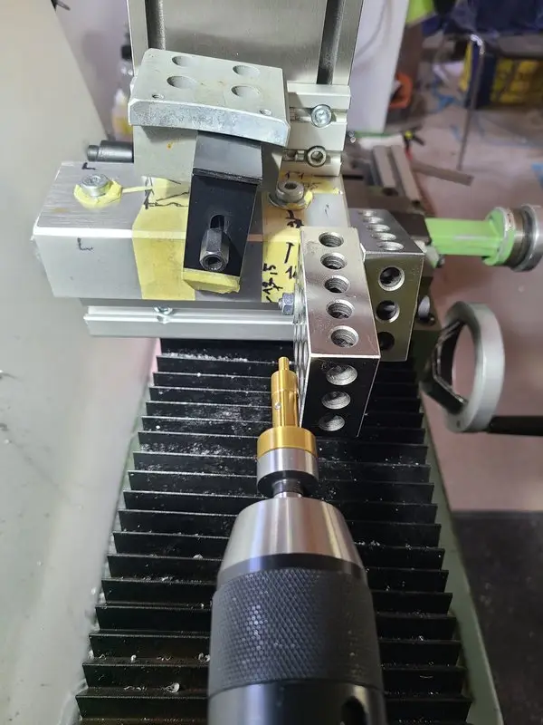 Aluminum block mounted on the Emcomat while centering the bushing seats
