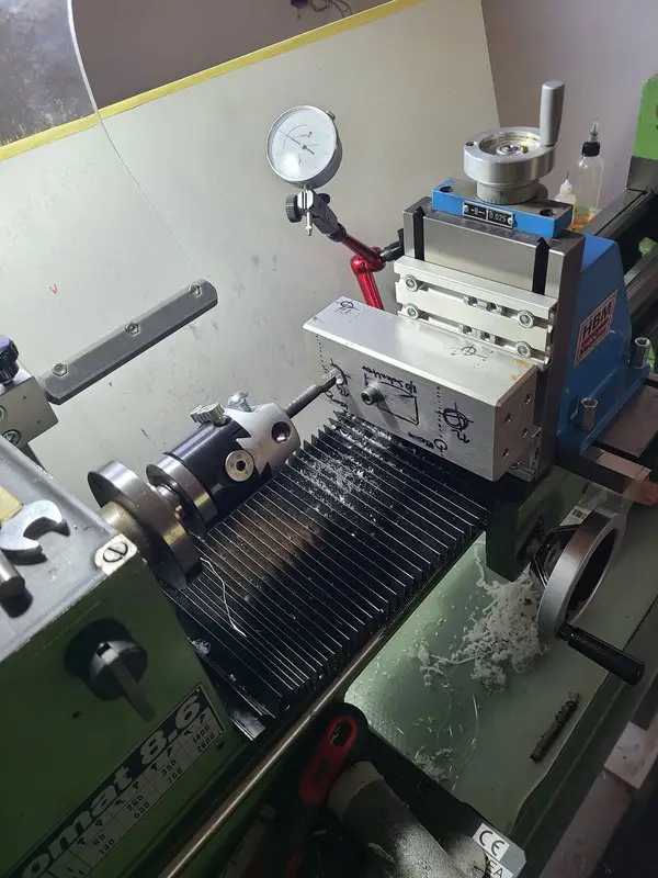 Aluminum block mounted on the Emcomat while boring the bushing seats